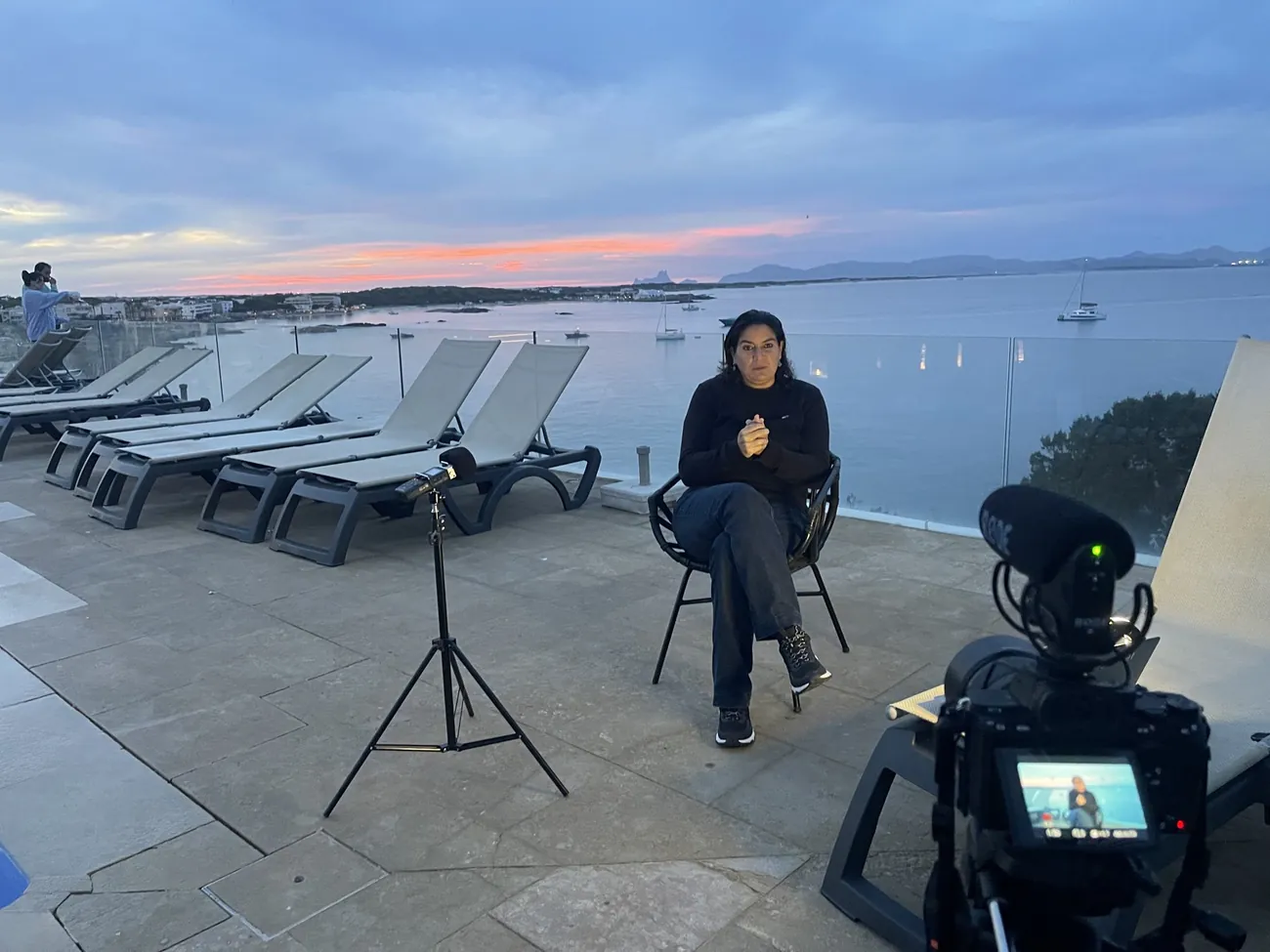 Interview set at sunset by the sea
