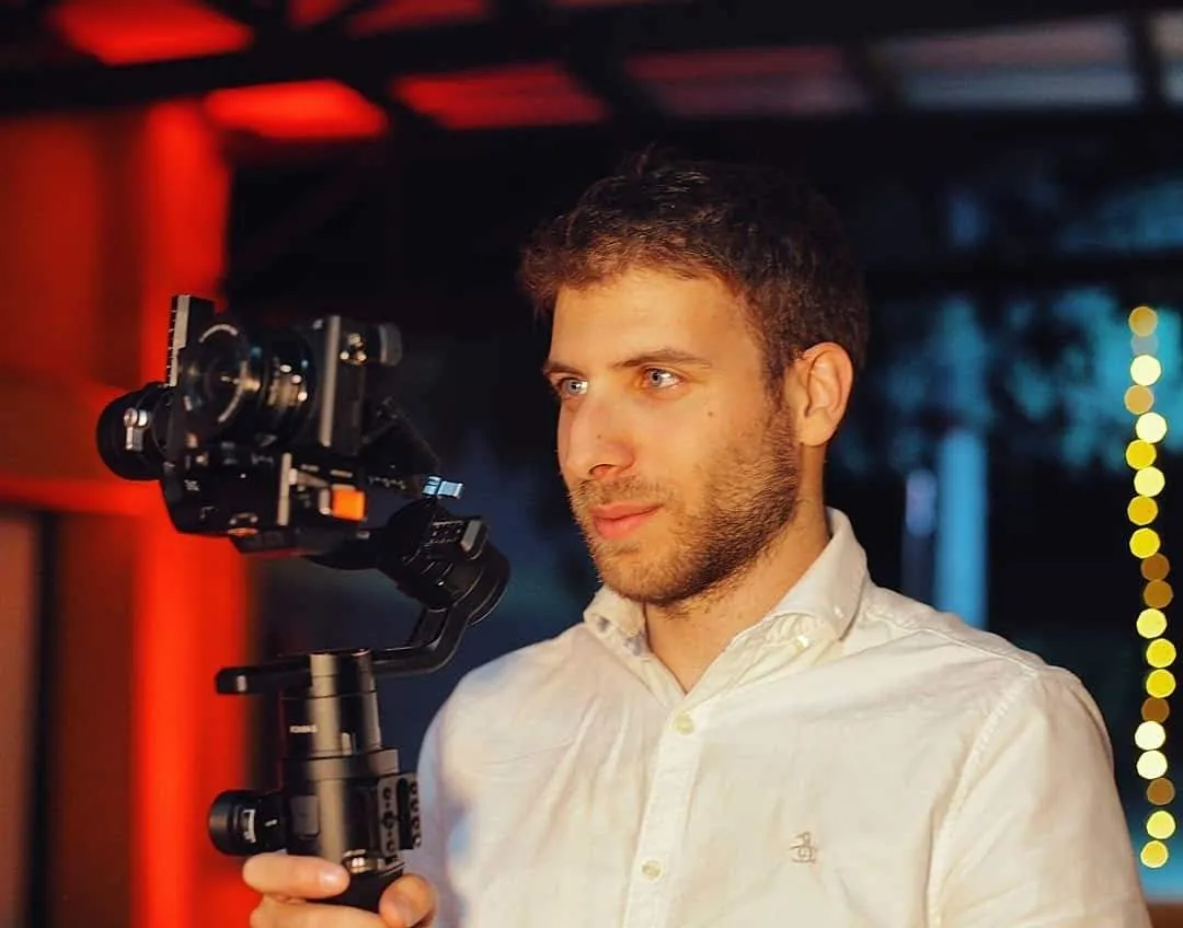 Gabriel operating a camera on a gimbal